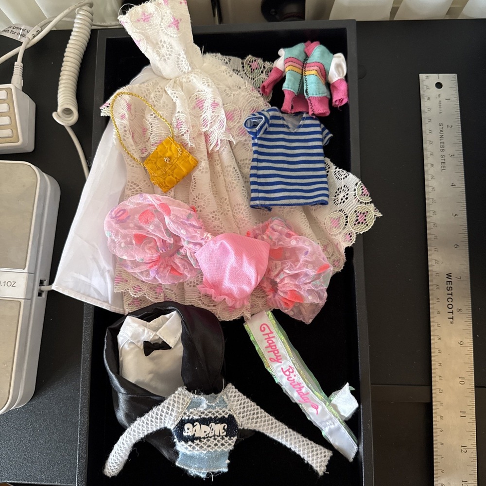 Lotof Barbie‎ doll clothesincluding 1 gown, o1 purse, a tuxedo Coat shirt, &more
